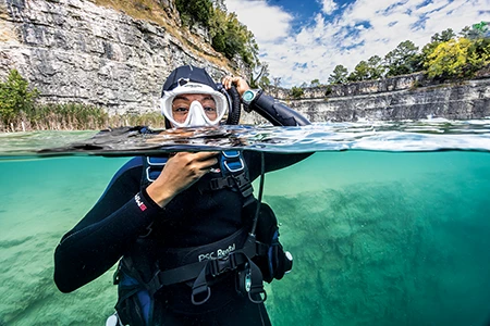 diver in quarry lake