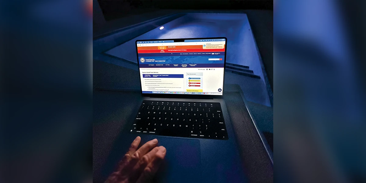 the U.S. Department of State’s Travel Advisory system on a laptop.