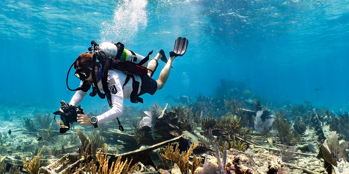 A HADS diver photographs the coral-covered Mandalay