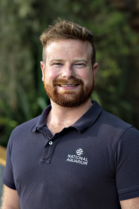 Close-up of Tanner Hughes, an assistant dive safety officer and volunteer diver coordinator at the National Aquarium.
