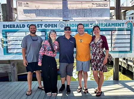 The author (center) poses with his rescuers. 