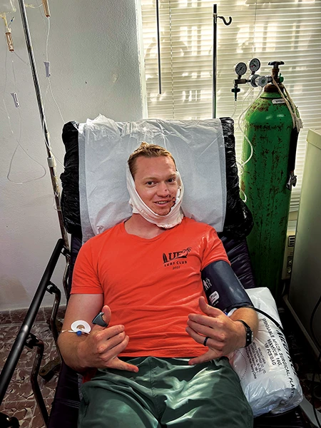 Robert Porter smiles at the camera while receiving care.