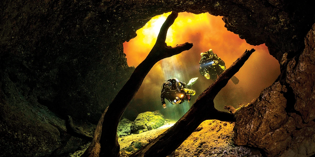 Rebreather divers enter the Little River Springs cave system
