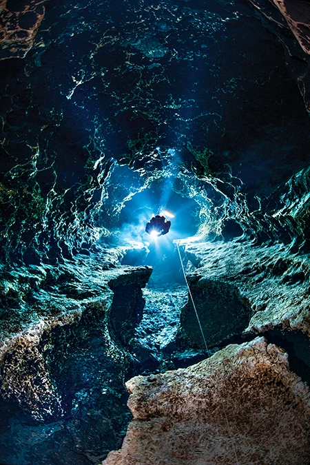 Cave diver Jake Rehacek explores passageways inside of Devil’s Spring System.