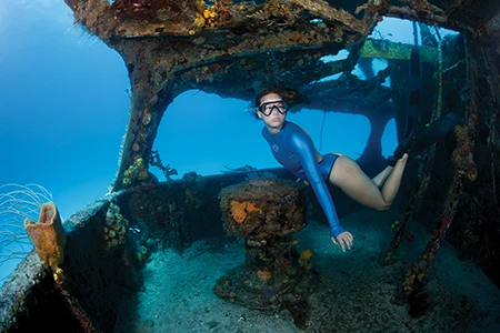 Freediver Katie Kilbride explores wreck.
