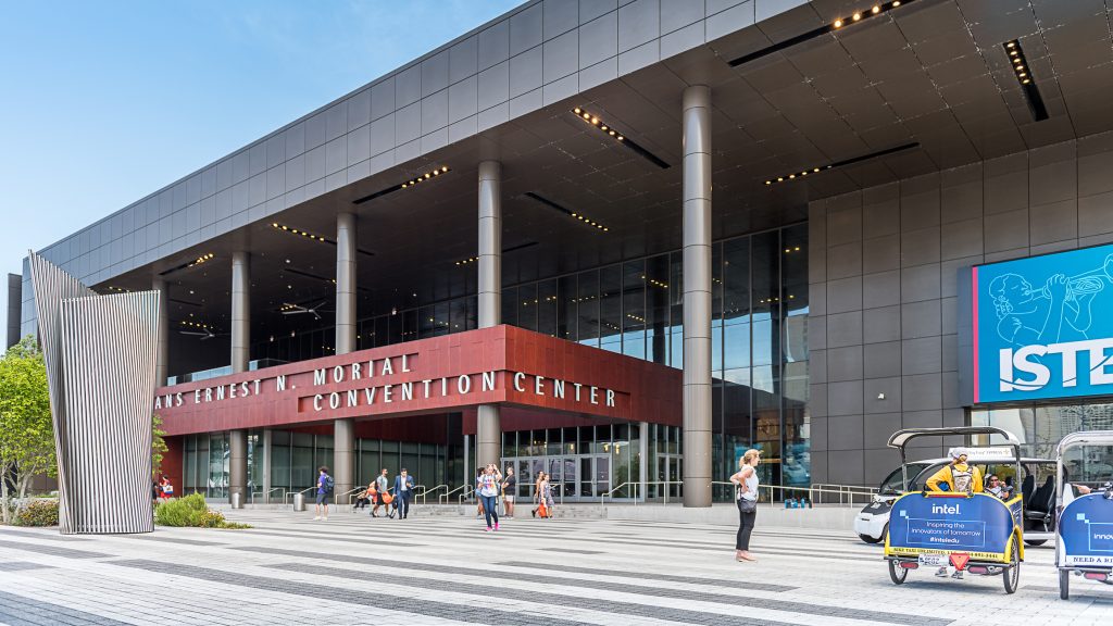 People walking around New Orleans Ernest N. Morial Convention Center. It is the 5th-largest facility of its kind in the United States and was named in honor of Ernest N. Morial, the city's first African American mayor.