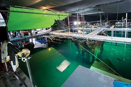The crew preps a boat before shooting a close-up of Michael Douglas.