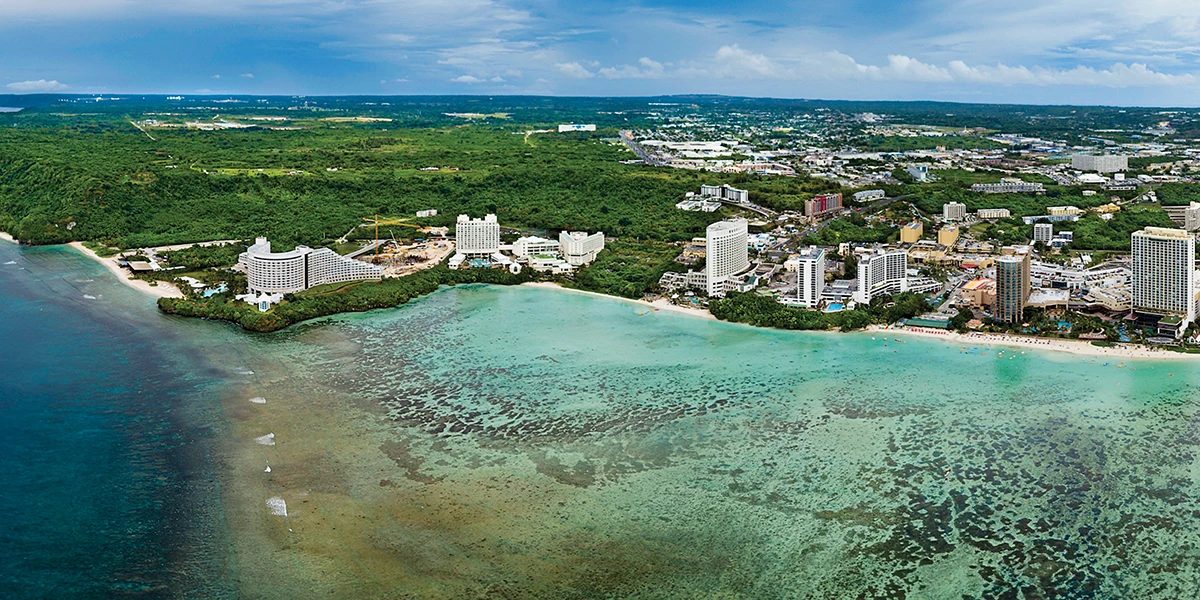 This aerial view reveals the sweeping curve of Tumon Bay, Guam’s main tourism district.