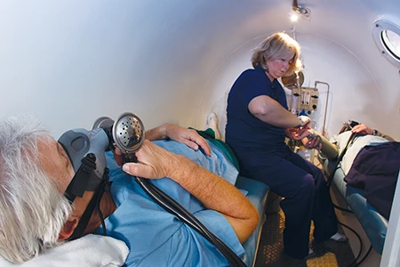Divers receive treatment in a decompression chamber.
