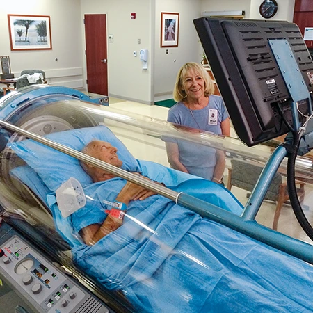 Man in hyperbaric chamber.